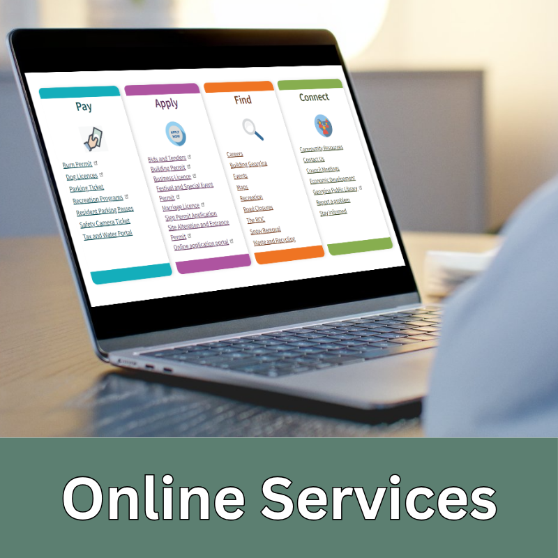 a laptop on a table and on the screen is a webpage with online services